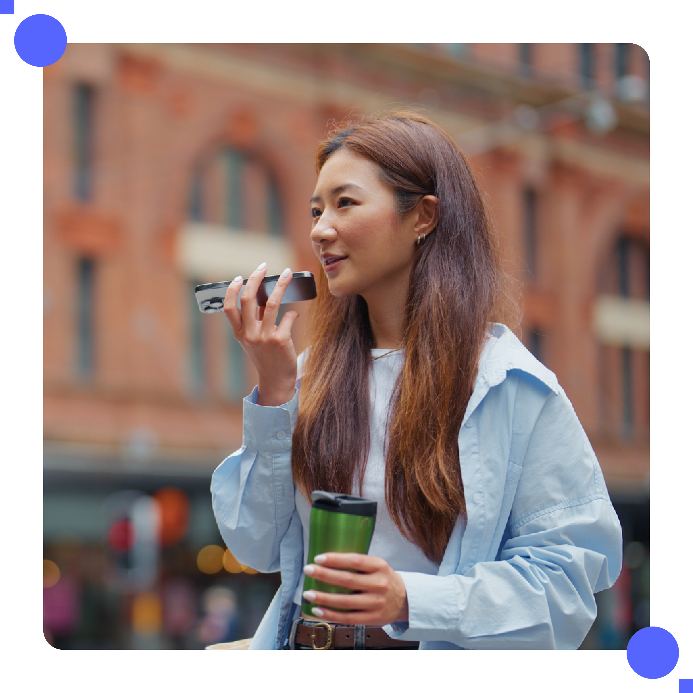 Asian woman speaking into mobile phone.