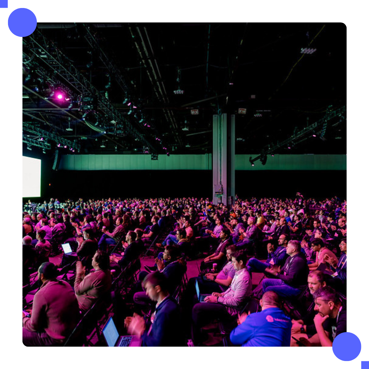 Conference attendees in keynote room.